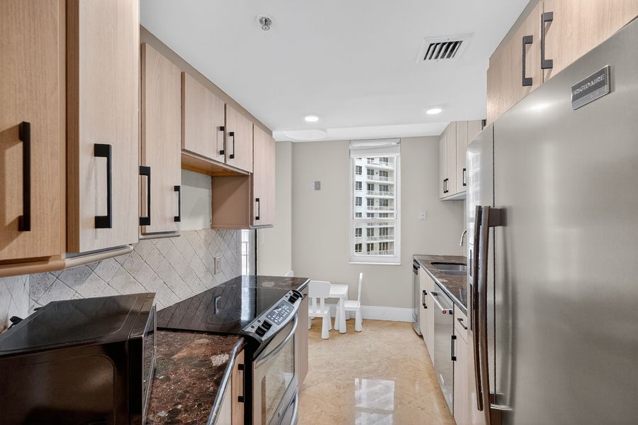 Kitchen with stainless appliances and granite counters