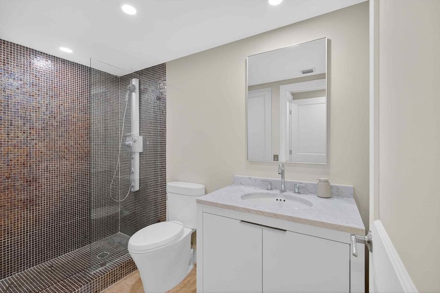 Primary bath with glass mosaic walk-in shower
