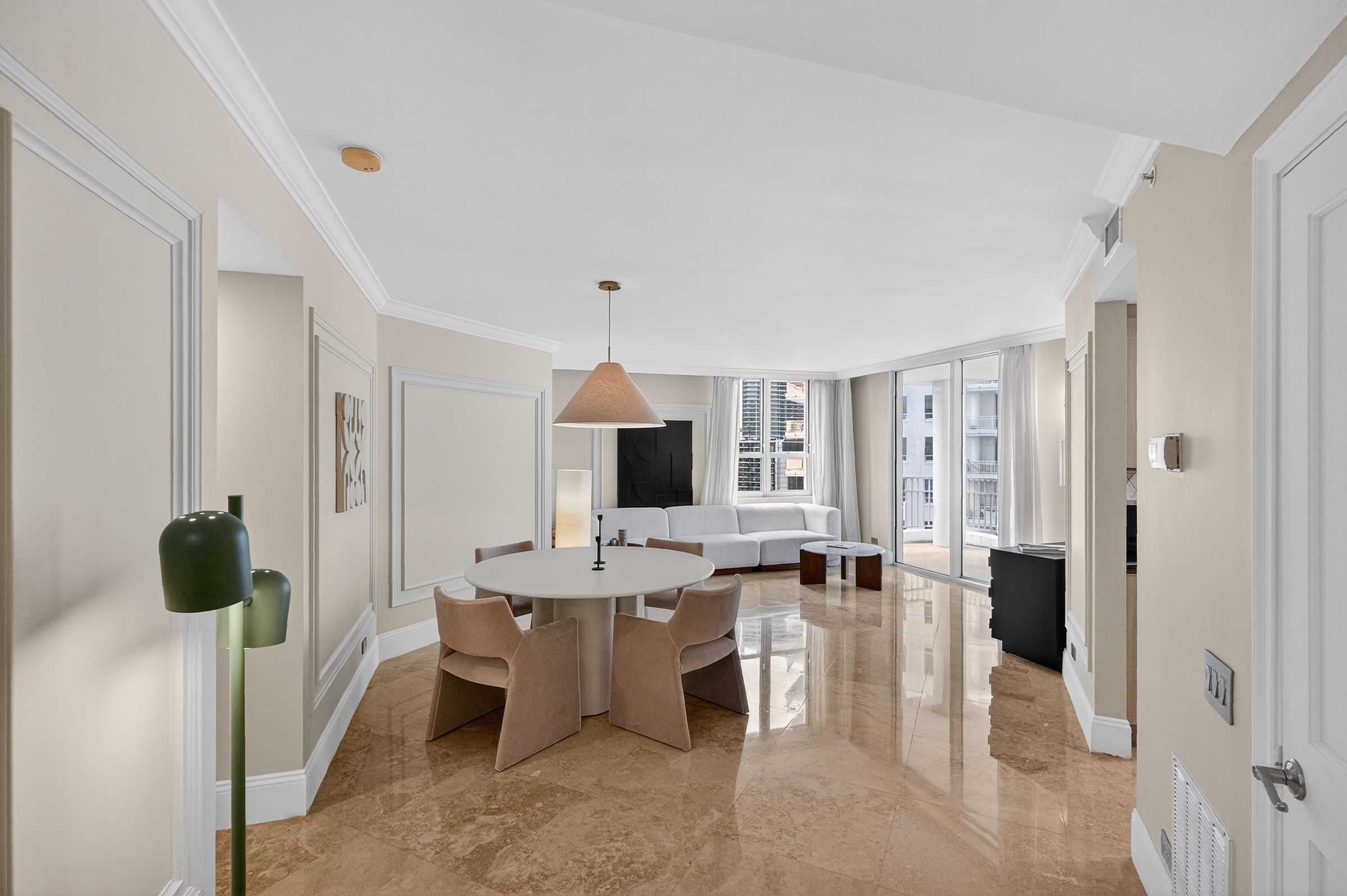 Open living and dining room with Italian marble floors